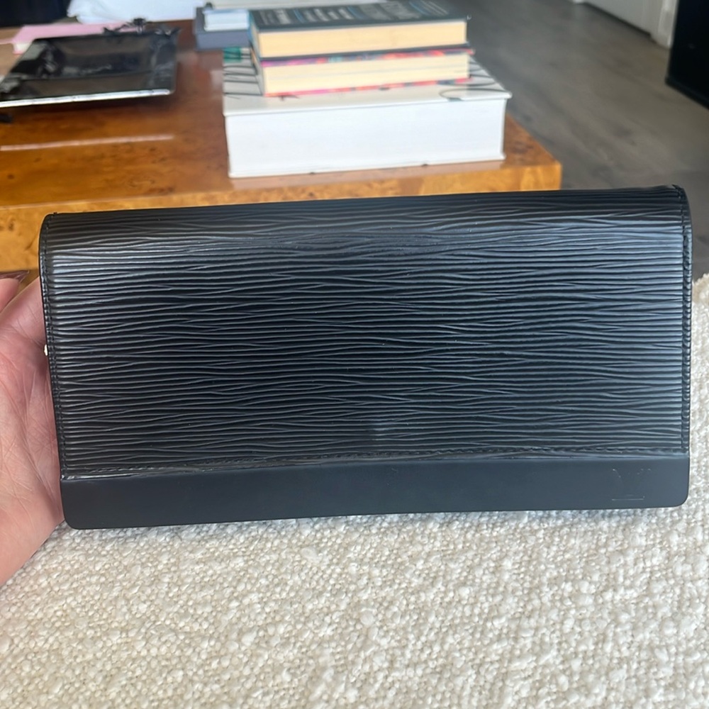 Louis Vuitton black clutch.